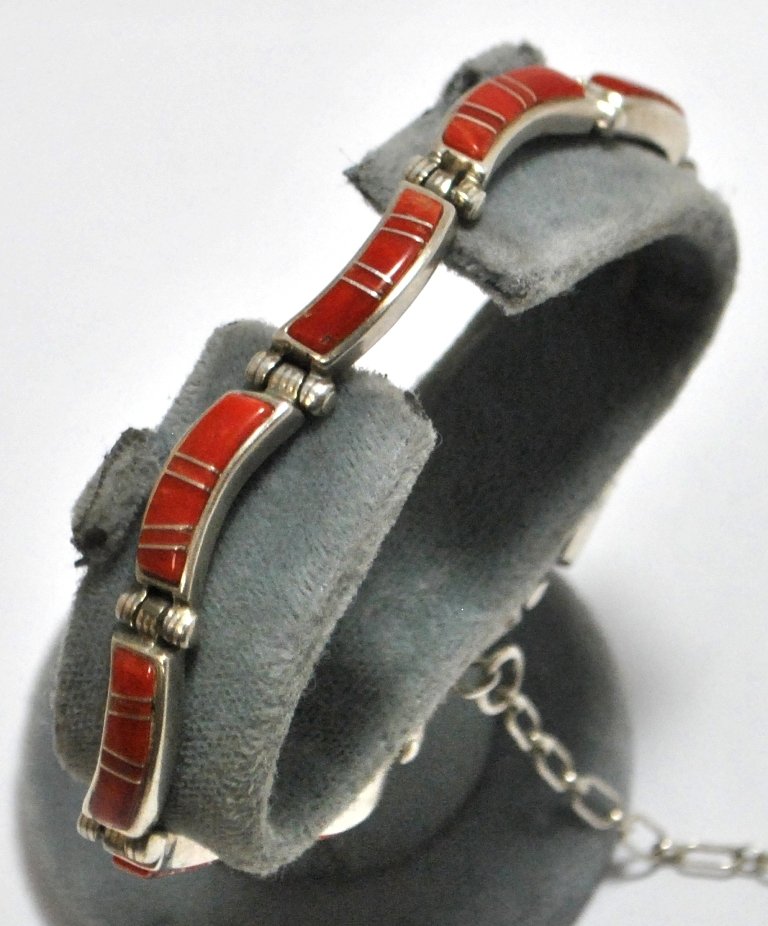 Old Pawn Coral Sterling Silver Link Bracelet: Old Pawn Coral Sterling Silver Link Bracelet Measures 7-1/2 long by 1/4" to 3/8" wide. Has a clasp and a locking chain to secure it. Weight: 23.6g SKU: br1052"