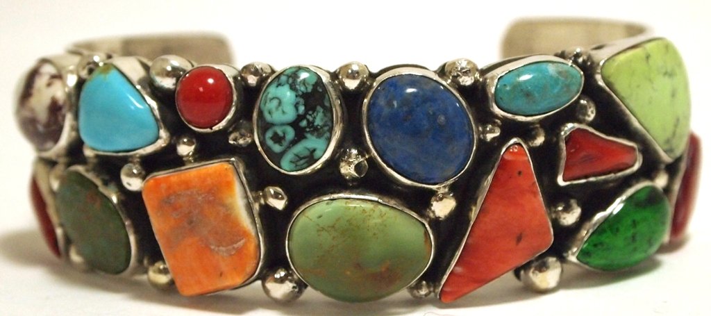 Dead Pawn Navajo Multi-Stone Sterling Silver Cuff Brace: Dead Pawn Navajo Multi-Stone Sterling Silver Cuff Bracelet - Emer Thompson Measures 5-3/4 around with a 1-1/4" gap, 1" wide. Stones present: Denim Lapis Lazuli, Turquoise, Green Turquoise, Spiny Oyste