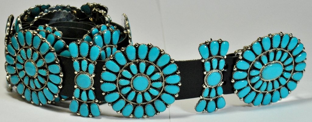 Navajo Turquoise Sterling Silver Concho Belt - Juliana : Navajo Turquoise Sterling Silver Concho Belt - Juliana Williams Belt measures 44" long. Large badges measure 2-1/2" tall by 2-1/2" wide. Small badges measure 2-1/2" tall by 1" wide. SKU: be0002