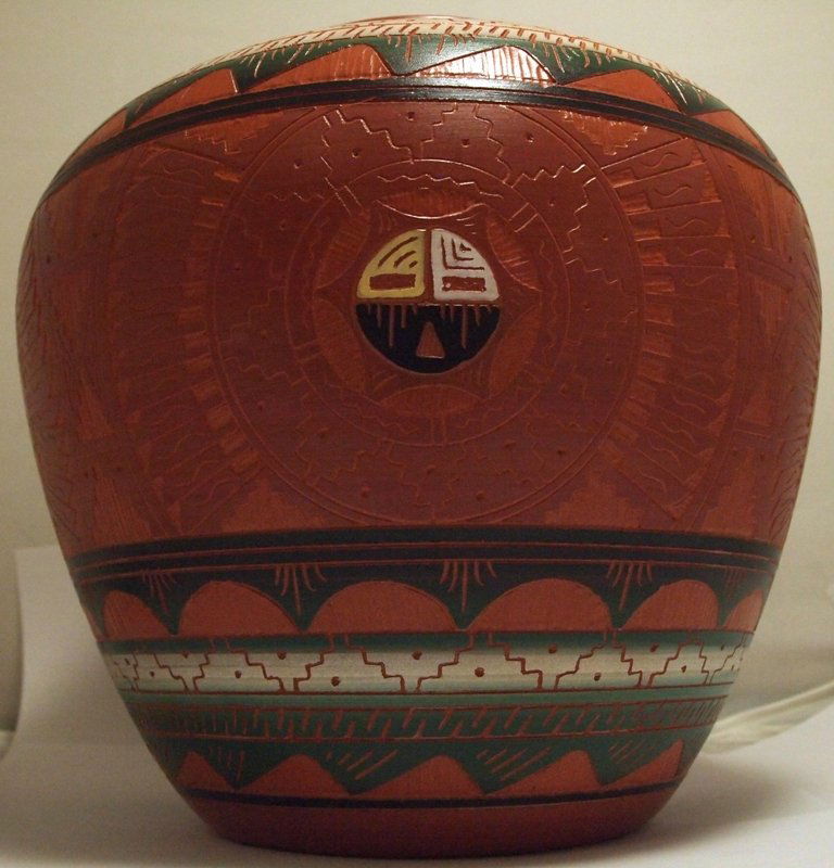 Navajo Etched & Hand Painted Sun Face Pottery - Casey M: Navajo Etched & Hand Painted Sun Face Pottery - Casey Morgan Height: 8" Opening Width: 4" Circumference: 28-3/4" Maximum Width: 8-3/4" Bottom Width: 4-1/2" Our shipping costs for pottery are $8.99 wit