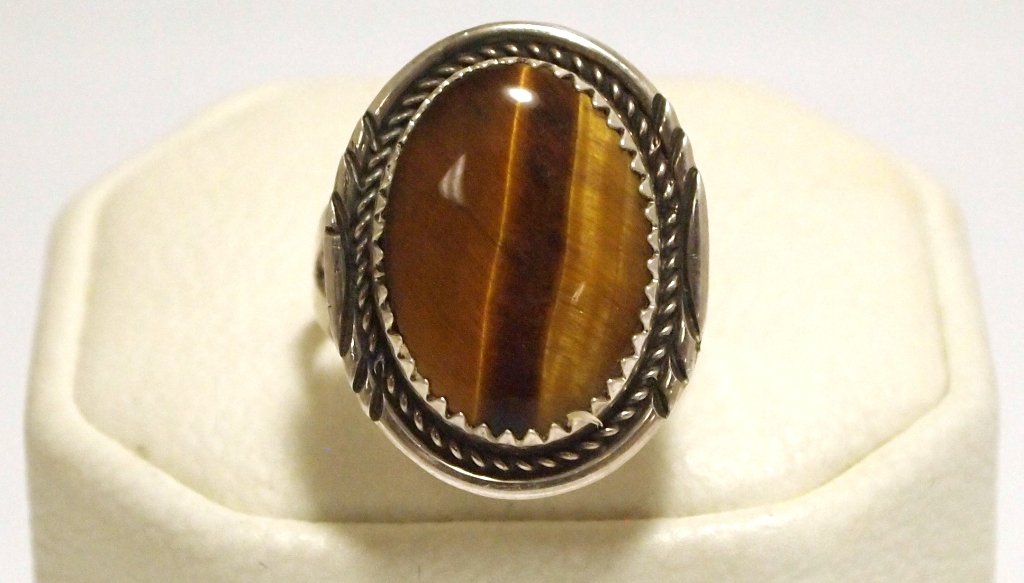 Navajo Tiger's Eye Sterling Silver Women's Ring - Herma: Navajo Tiger's Eye Sterling Silver Women's Ring - Herman Lee Stone measures 11/16" tall by 1/2" wide, face measures 15/16" tall by 3/4" wide. Band measures 1/16" wide, size: 7.5 Weight: 4.1g SKU: rw01