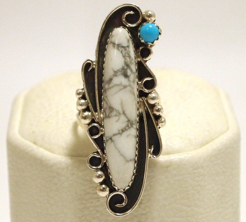 Navajo Howlite & Turquoise Sterling Silver Women's Ring: Navajo Howlite & Turquoise Sterling Silver Women's Ring - Susan Yazzie Face measures 1-5/8 tall by 5/8" wide. Band measures 1/16" wide, size: 5.5 Weight: 6.1g SKU: rw0418"