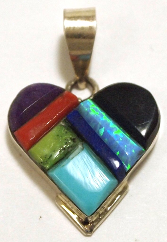 Navajo Multi-Stone Inlay Sterling Silver Pendant - Edis: Navajo Multi-Stone Inlay Sterling Silver Pendant - Edison Yazzie Measures 1-1/4 tall by 3/4" wide including bale. Bale opening measures 1/4". Stones present: Onyx, Coral, Turquoise, Opal, Sugilite, Ga