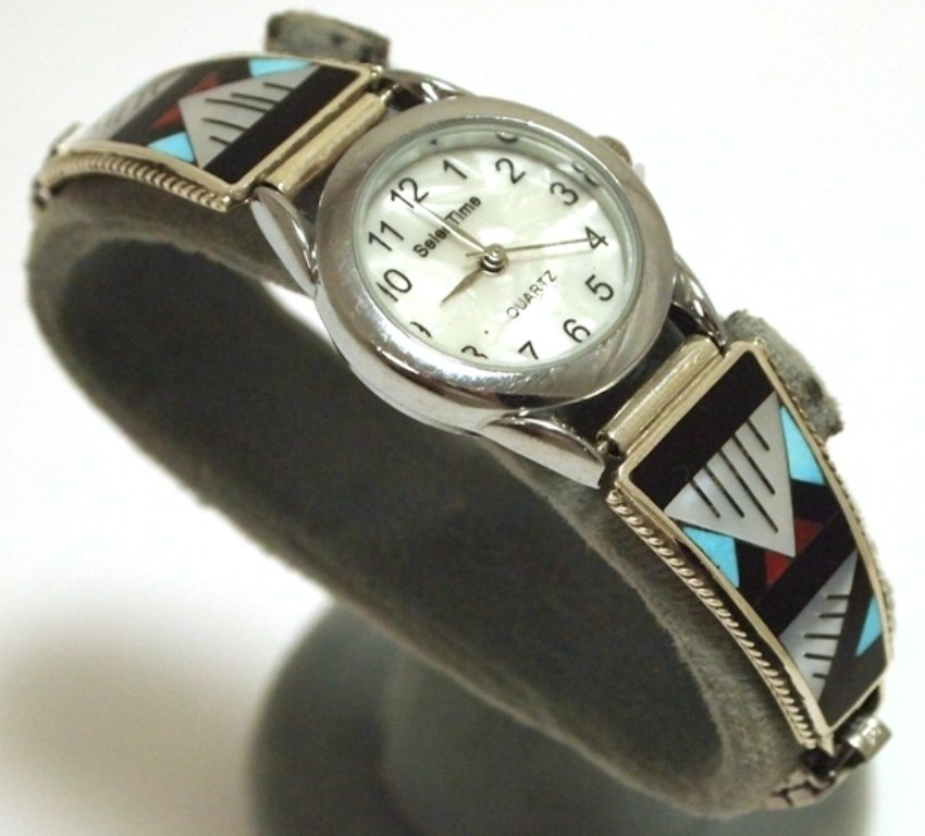 Zuni Multi-Stone Inlay Sterling Silver Women's Watch - : Zuni Multi-Stone Inlay Sterling Silver Women's Watch - Leander & Lisa Otholi Measures 7 around (stretchable band at rest) by 5/16" wide (band), 5/8" wide (tips), 1" wide (face). Stones present: Mother