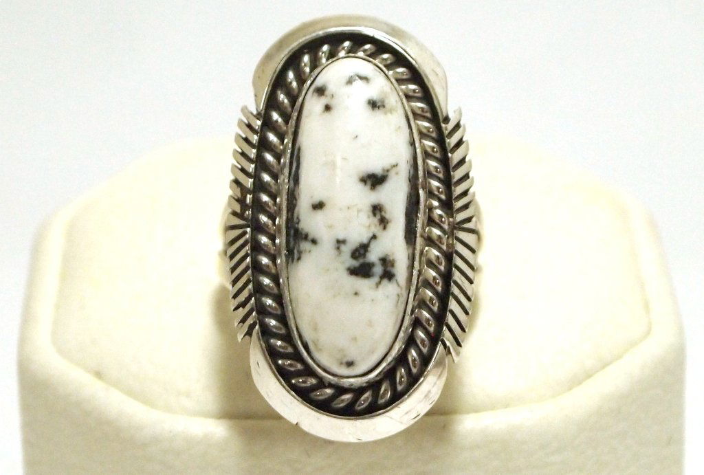 Navajo White Buffalo Sterling Silver Women's Ring - Eug: Navajo White Buffalo Sterling Silver Women's Ring - Eugene Belone Stone measures 7/8 tall by 5/16" wide. Face measures 1-1/8" tall by 5/8" wide. Band measures 1/8" wide, size: 6.75 Weight: 9g SKU: rw0