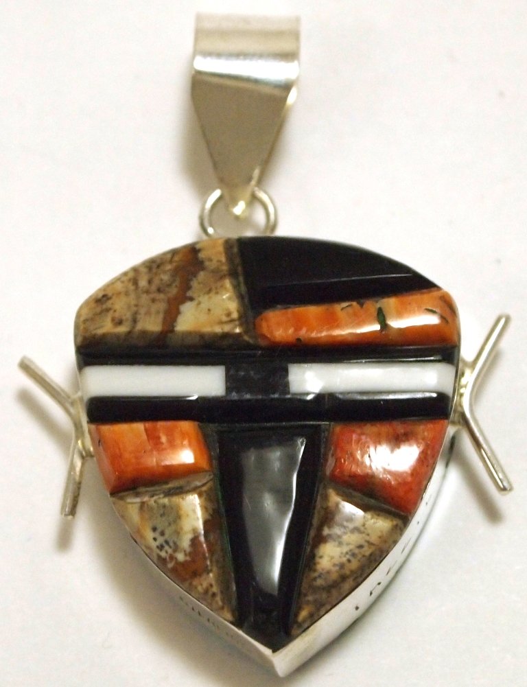 Navajo Multi-Stone Reversible Inlay Sterling Silver Pen: Navajo Multi-Stone Reversible Inlay Sterling Silver Pendant - Edison Yazzie Measures 1-1/2 tall by 1-1/8" wide including bale. Bale opening measures 1/4". Stones present: Opal, Jasper, Spiny Oyster, O