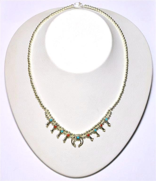 Navajo Coral & Turquoise Sterling Silver Mini Squash Bl: Navajo Coral & Turquoise Sterling Silver Mini Squash Blossom Necklace - Larry Curley Measures 17" around. Naja measures 1/2" tall by 1/2" wide. Weight: 13.4g