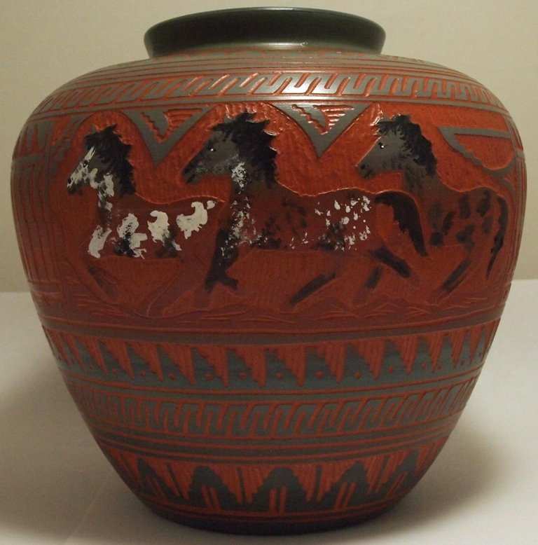 Navajo Etched & Painted Horses Pottery - Aaron Watchman: Navajo Etched & Painted Horses Pottery - Aaron Watchman Height: 8Opening Width: 3-3/4"Circumference: 28-1/2"Maximum Width: 9"Bottom Width: 4-1/2"Our shipping costs for pottery are $8.99 within the U.S