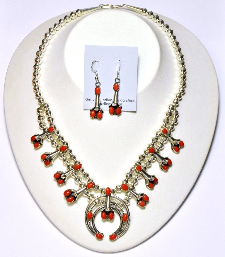 Navajo Coral Squash Blossom Necklace & Earrings Set - P: Navajo Coral Squash Blossom Necklace & Earrings Set - Phil & Lenore Garcia Measures 16 around. Naja measures 1-1/2" tall by 1-3/8" wide. Earrings measure 1-5/8" tall by 7/16" wide. SKU: se0070"