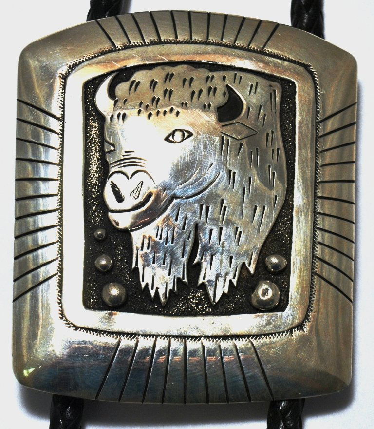 Navajo Sterling Silver Buffalo Bolo Tie - Tommy Singer: Navajo Sterling Silver Buffalo Bolo Tie - Tommy Singer Measures 3-1/2 tall by 3" wide, 45" around. SKU: bo0029"