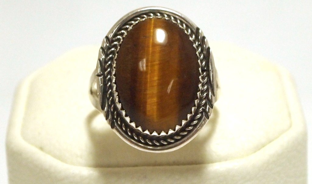 Navajo Tiger's Eye Sterling Silver Women's Ring - Herma: Navajo Tiger's Eye Sterling Silver Women's Ring - Herman Lee Stone measures 11/16 tall by 1/2" wide. Face measures 7/8" tall by 3/4" wide. Band measures 1/16" wide, size: 9.5 Weight: 4.3g SKU: rw0245"