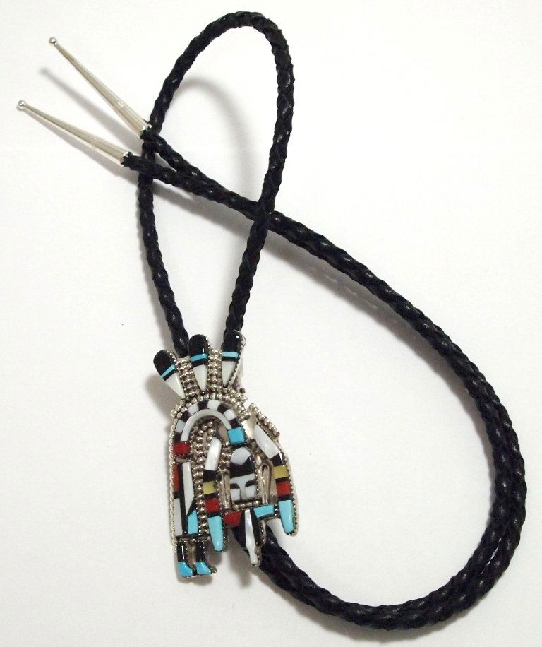 Zuni Multi-Stone Inlay Rainbow Kachina Sterling Silver : Zuni Multi-Stone Inlay Rainbow Kachina Sterling Silver Bolo Tie - Herbert Cellicion Measures 2-5/8 tall by 1-1/2 wide, 37" around. Tips measure 1-5/8" tall by up to 1/4" wide. Stones present: White &a