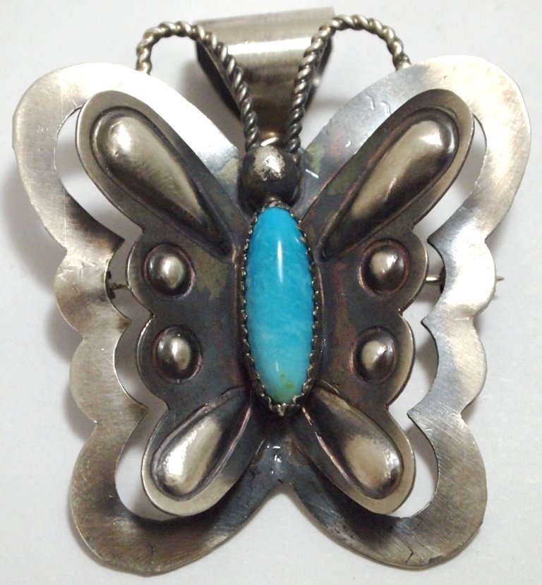 Navajo Turquoise Sterling Silver Butterfly Pendant & Pi: Navajo Turquoise Sterling Silver Butterfly Pendant & Pin - Tim Yazzie Measures 2-1/8 tall by 1-3/4" wide including bale. Bale opening measures 3/8". Pin on back measures 1-1/4". Weight: 13.9g SKU: pp0