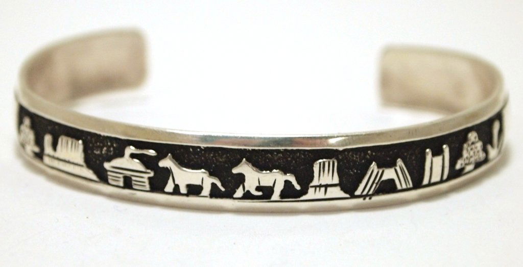 Navajo Sterling Silver Pueblo Cuff Bracelet - Tommy: Navajo Sterling Silver Pueblo Cuff Bracelet - Tommy Singer Measures 5-3/4 around with a 1-1/4" gap, 3/8" wide. Weight: 14.8g SKU: br1815"