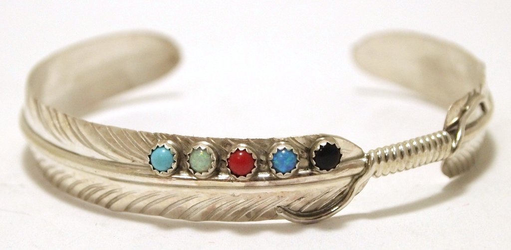 Navajo Multi-Stone Sterling Silver Feather Cuff: Navajo Multi-Stone Sterling Silver Feather Cuff Bracelet - Chris Charley Measures 5" around with a 1" gap, 3/8" wide. Chris' pieces are exceedingly affordable; because of this the silver is thin and f
