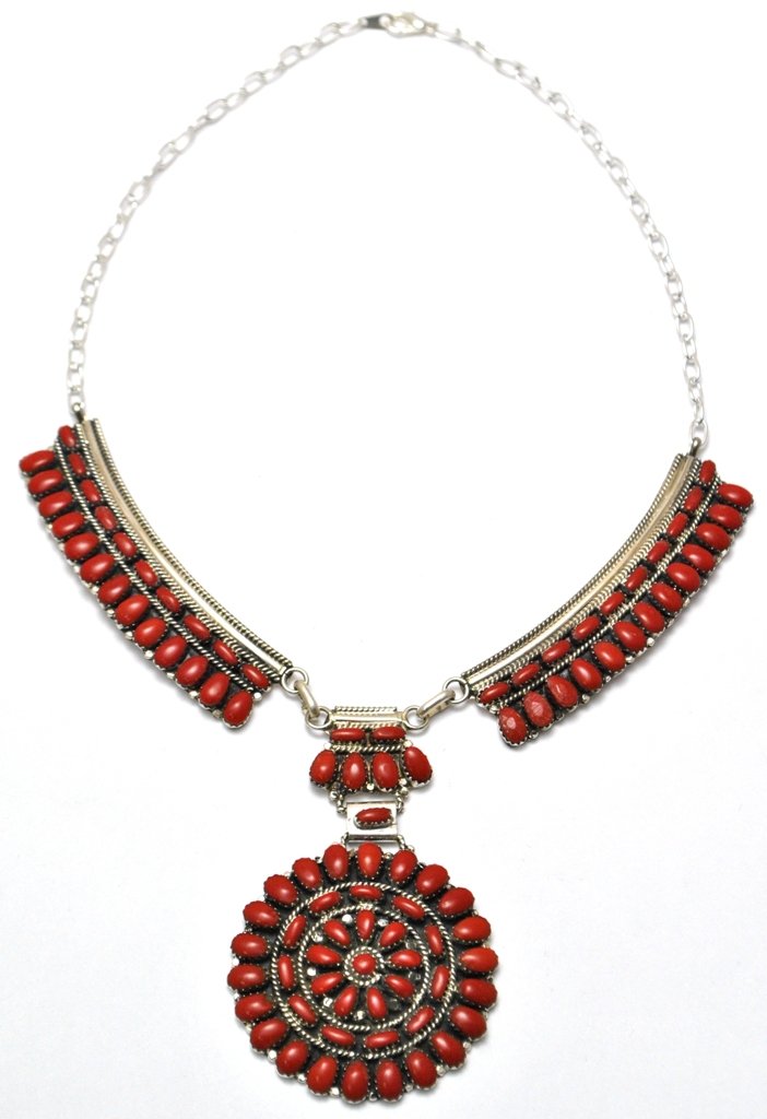 Navajo Coral Cluster Necklace - Juliana Williams: Navajo Coral Cluster Necklace - Juliana Williams Measures 17" around. Pendant measures 2" in diameter. Side strips measure 3" long by 3/4" wide. Middle connector measures 1-1/8" tall by 1" wide. Weigh