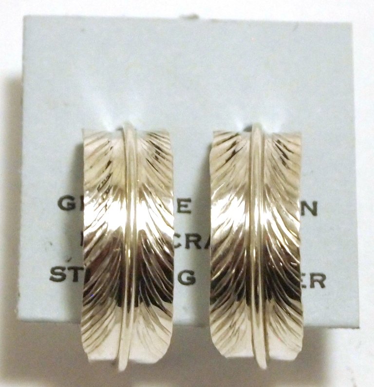 Navajo Sterling Silver Feather Half-Ring Post Earrings: Navajo Sterling Silver Feather Half-Ring Post Earrings - Chris Charley Measure 3/4 tall by 1/4" wide by 1/2" deep. Weight: 1.6g SKU: ea0457"