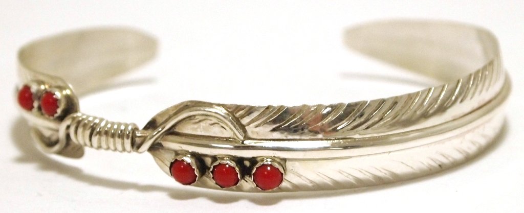 Navajo Coral Sterling Silver Feather Cuff Bracelet -: Navajo Coral Sterling Silver Feather Cuff Bracelet - Chris Charley Measures 5 around with a 7/8" gap, 3/8" wide. Chris' pieces are exceedingly affordable; because of this the silver is thin and flexib