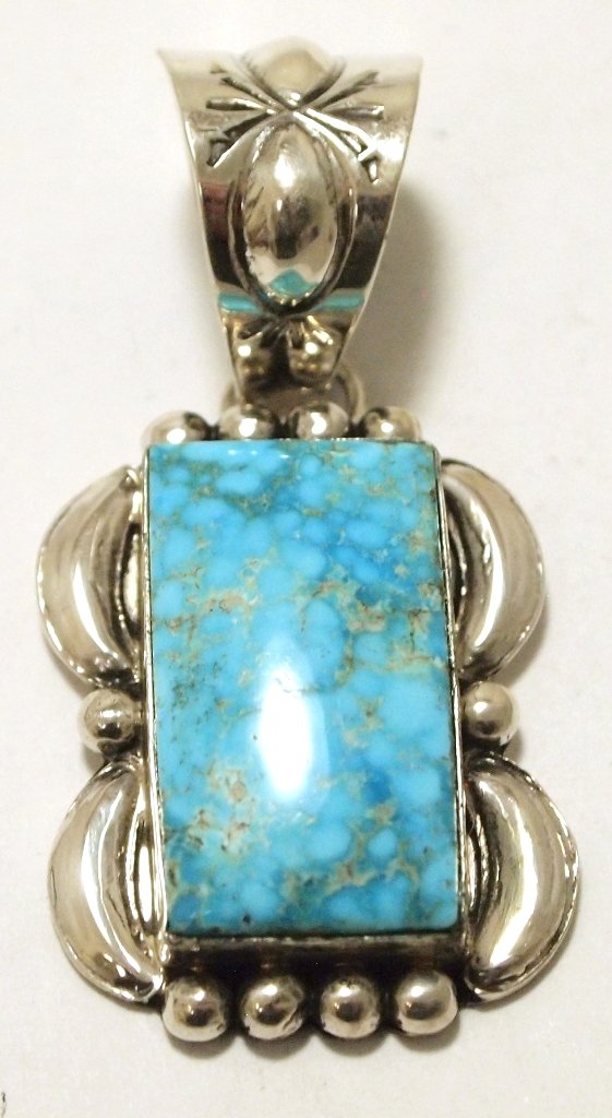 Navajo Spider Web Kingman Turquoise Sterling Silver: Navajo Spider Web Kingman Turquoise Sterling Silver Pendant - Mary Ann Spencer Measures 1-7/8 tall by 7/8" wide including bale. Bale opening measures 1/2". Weight: 12.4g SKU: pp1158"