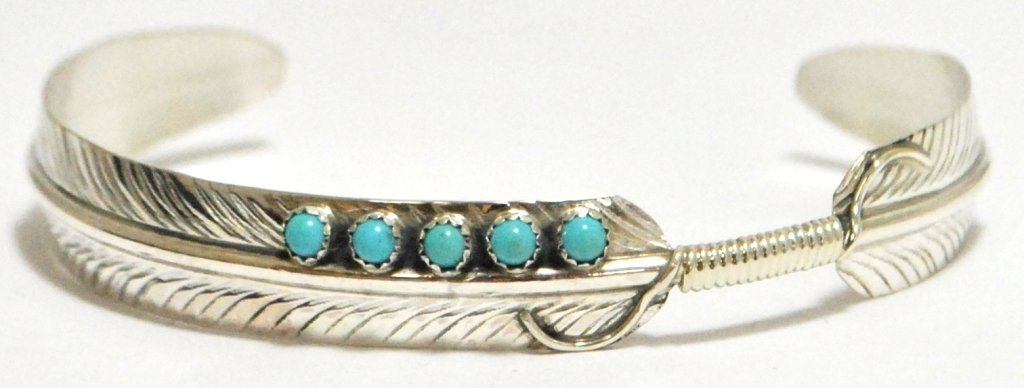 Navajo Turquoise Dots Sterling Silver Feather Bracelet: Navajo Turquoise Dots Sterling Silver Feather Bracelet - Chris Charley Measures 5-1/4 around with a 1-1/4" gap, 3/8" wide. Chris' pieces are exceedingly affordable; because of this the silver is thin 