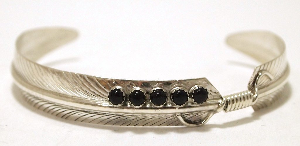 Navajo Onyx Sterling Silver Feather Cuff Bracelet -: Navajo Onyx Sterling Silver Feather Cuff Bracelet - Chris Charley Measures 5 around with a 1" gap, 3/8" wide. Chris' pieces are exceedingly affordable; because of this the silver is thin and flexible 