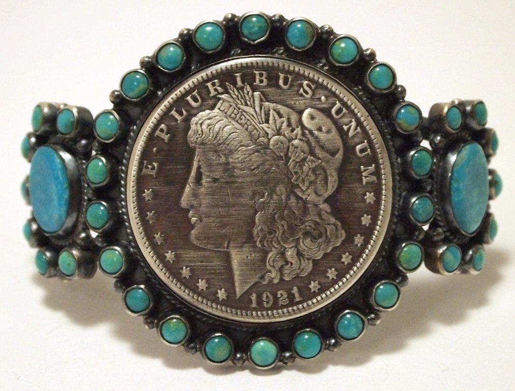 Navajo Turquoise & 1921 Morgan Silver Dollar Sterling: Navajo Turquoise & 1921 Morgan Silver Dollar Sterling Silver Cuff Bracelet - Dean Brown Measures 5-1/4 around with a 1-3/8" gap, 2" wide. Weight: 72.8g SKU: br2142"