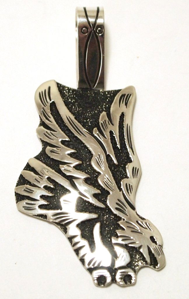 Navajo Sterling Silver Eagle Pendant - Richard Singer: Navajo Sterling Silver Eagle Pendant - Richard Singer Measures 2-3/4 tall by 1-1/4" wide including bale. Bale opening measures 3/8". Weight: 12.6g SKU: pp1138"