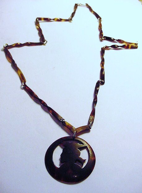 CARVED TORTOISE SHELL NECKLACE: CARVED TORTOISE SHELL NECKLACE