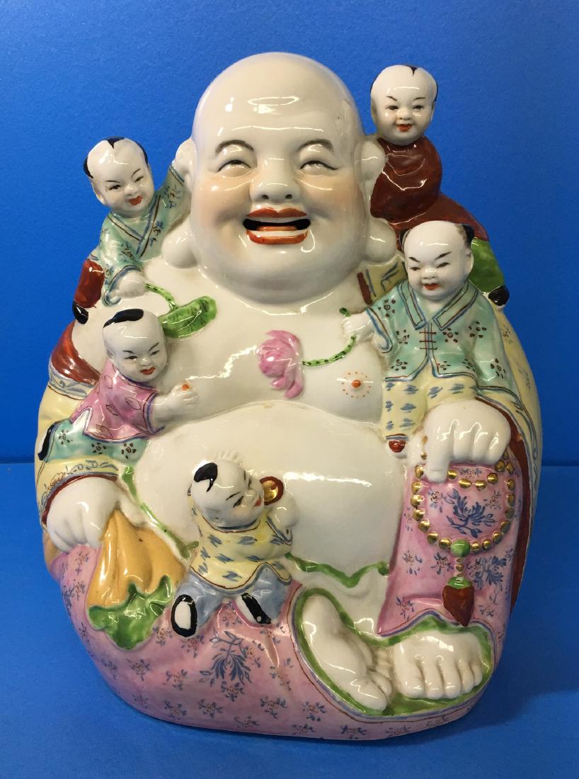 A FAMILY ROSE PORCELAIN YOUNG MAITREYA BUDDHA: A famille rose porcelain sculpture of laughing Maitreya buddha, with five kids playing on his shoulder, chest and belly in harmony. 26.5cmÃ—25cm