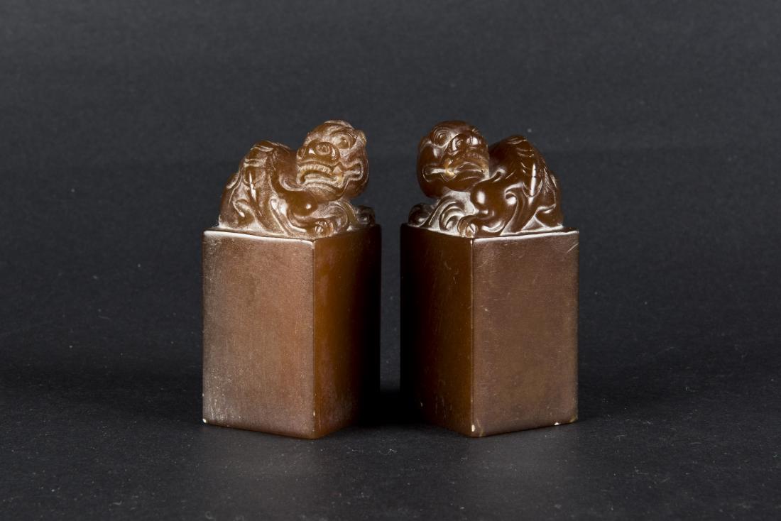 A PAIR OF SEAL-SHAPED BEAST SOAPSTONES (1 of 2)