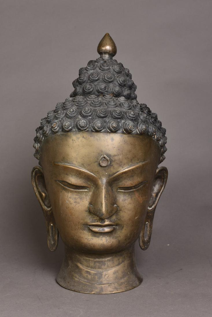 A BRONZE OF SAKYAMUNI BUDDHA HEAD (1 of 4)