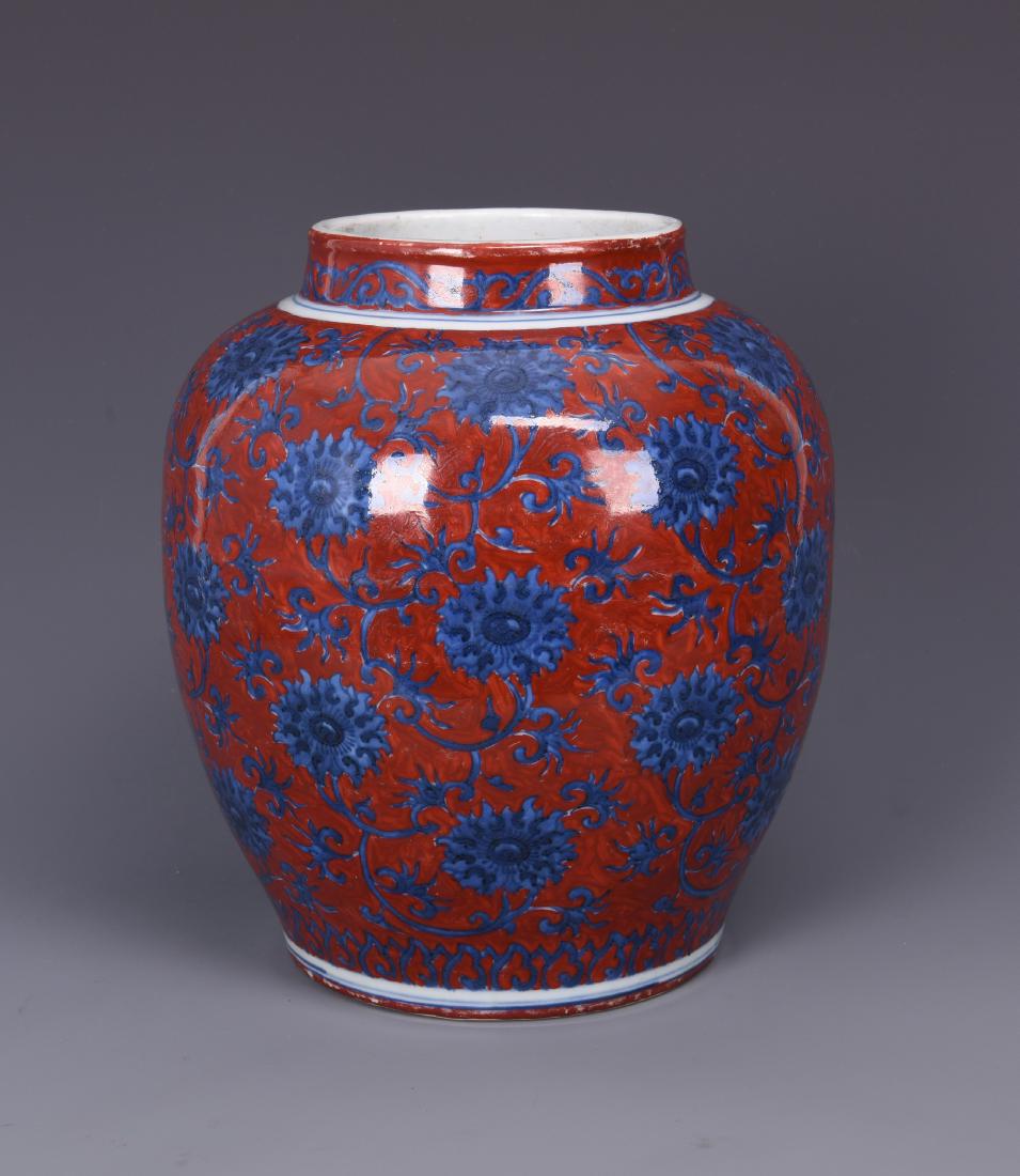 A COPPER RED GROUND BLUE AND WHITE PORCELAIN JAR