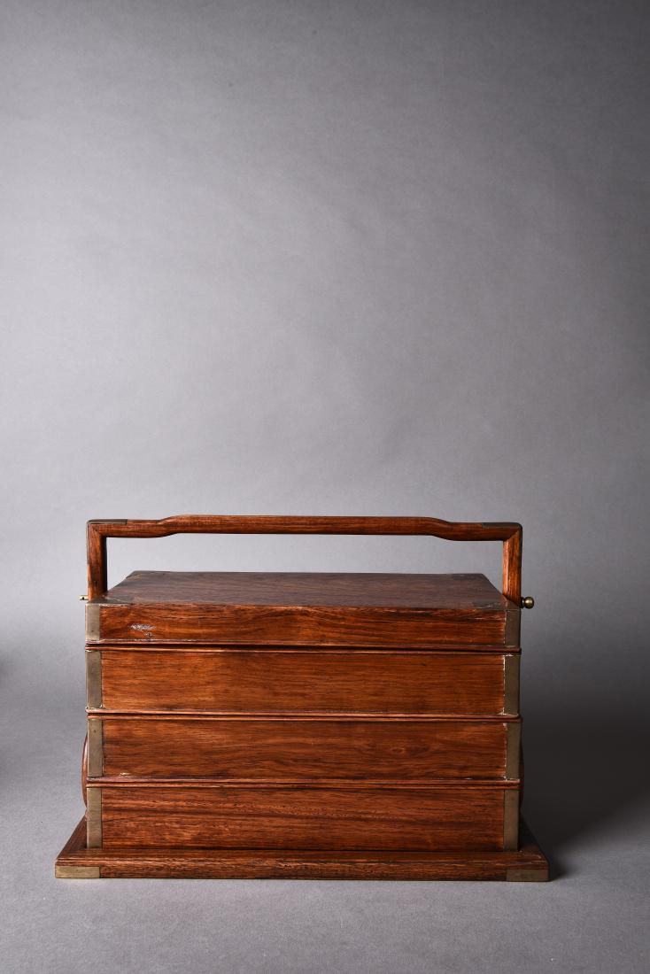 A THREE-TIERED HUANGHUALI BOX, TIHE, 18TH CENTURY (1 of 3)