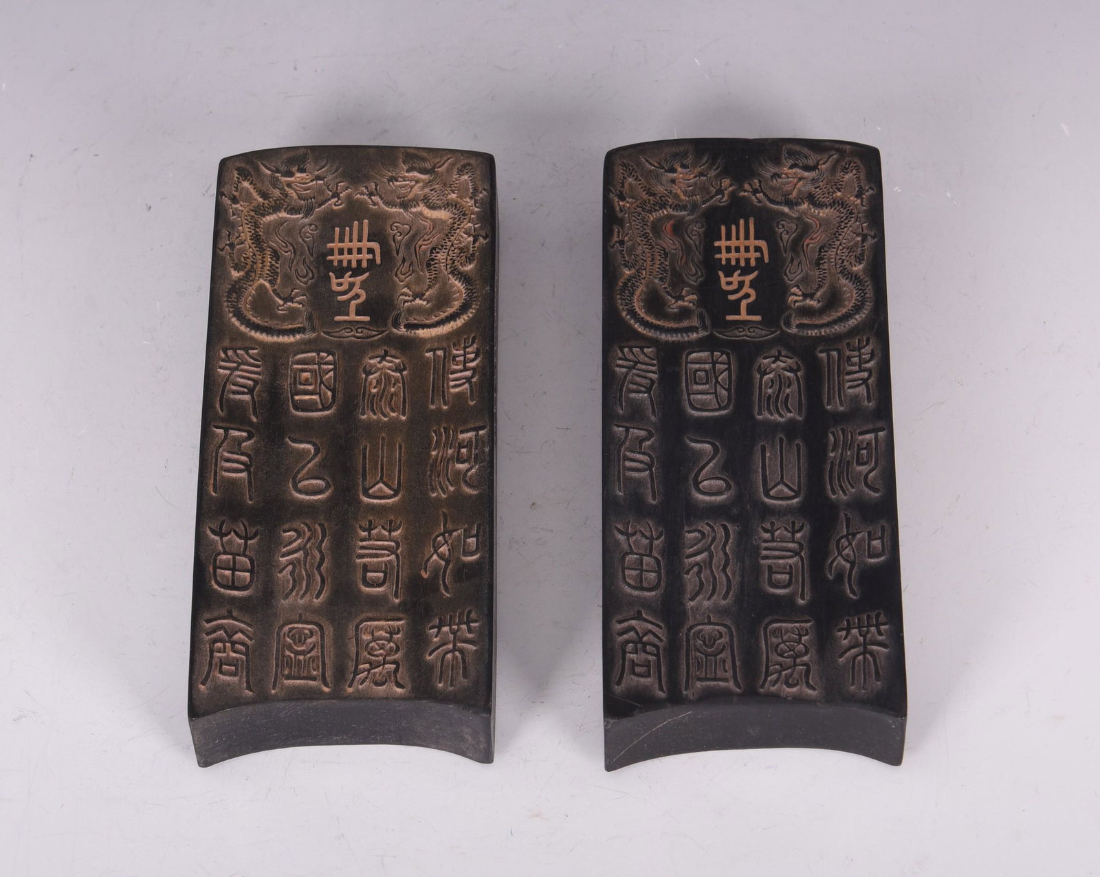 A PAIR OF CHINESE CARVED 'POETRY' INKSTONES: H13.5x5.5x2cm