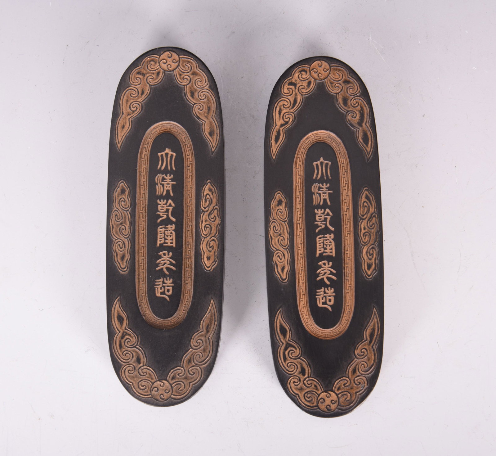 A PAIR OF CHINESE CARVED 'POETRY' INKSTONES: H15 x 5 x 1.6 cm