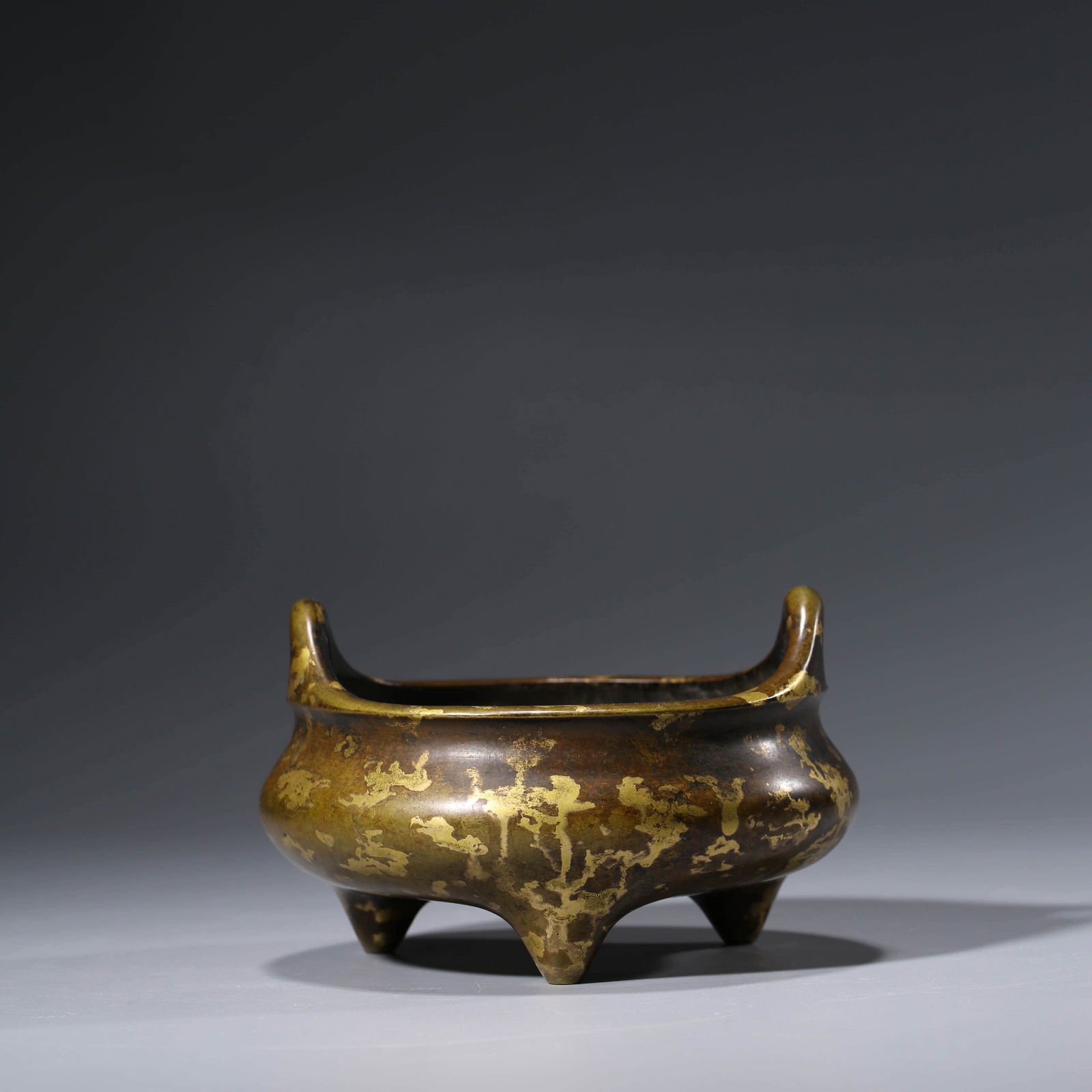 A CHINESE BRONZE GOLD SPLASHED TRIPOD CENSER (1 of 6)