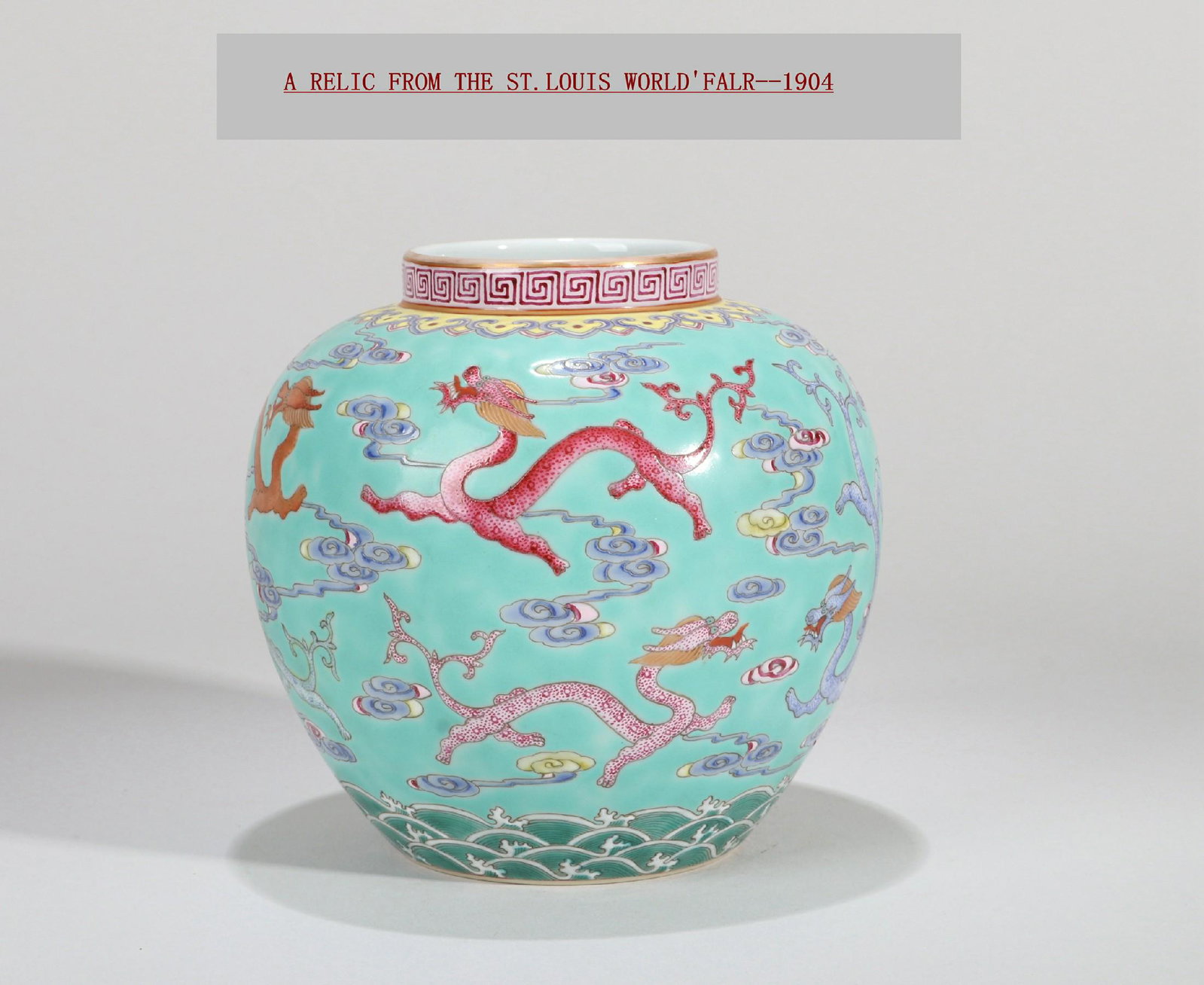 A SMALL TURQUOISE GROUND FAMILLE ROSE CLOUD AND DRAGON: A small Turquoise ground famille rose cloud and dragon pattern jar . heightï¼š 11.5 cm. The original collector got the exhibits from the China Pavilion of the 1904 St. Louis World Expo. Made in the