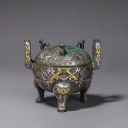 A BRONZE GILT-SILVER-INLAID COOKING VESSEL