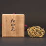 A CARVED JADE PLAQUE WITH JAPANESE BOX