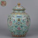 A TURQUOISE GROUND FAMILLE ROSE INTERLOCKING LOTUS JAR WITH LID