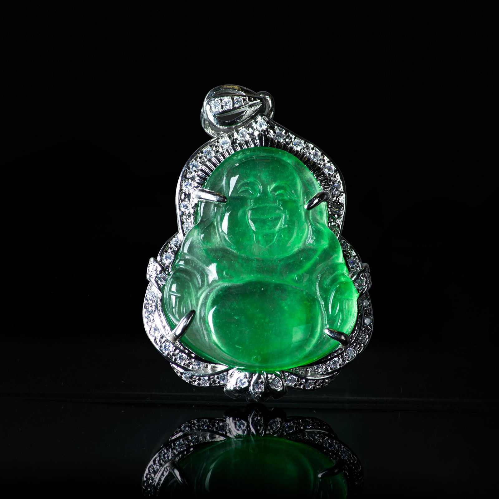 A JADEITE PENDANT OF BUDDHA: A jadeite pendant of Buddha. L3 x W2.5 cm