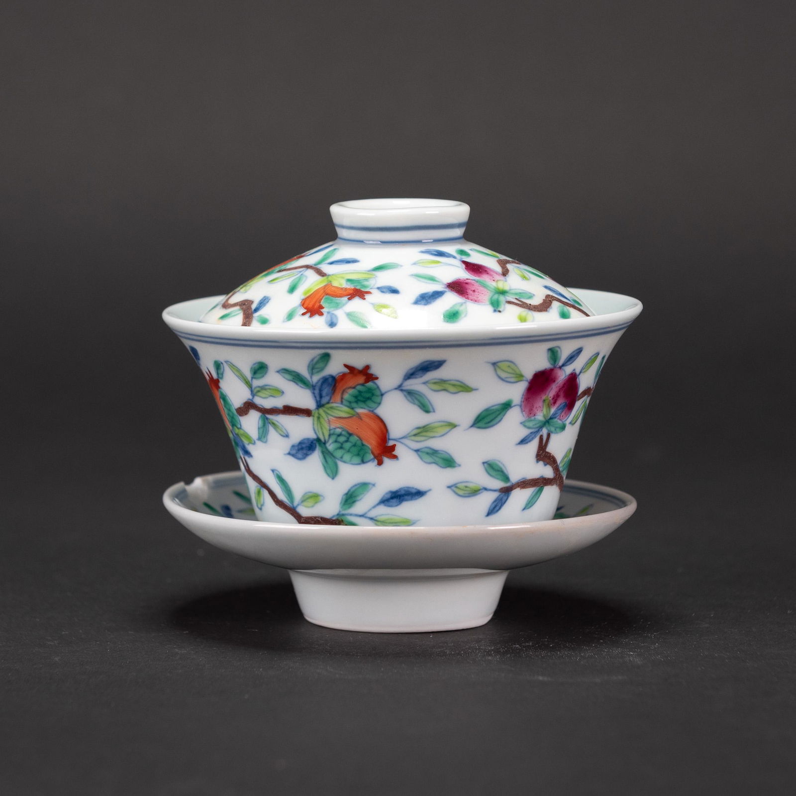 A DOUCAI 'FLORAL' CUP WITH COVER AND HOLDER: A DOUCAI 'FLORAL' CUP WITH COVER AND HOLDER . H6x10.9cm(cup)