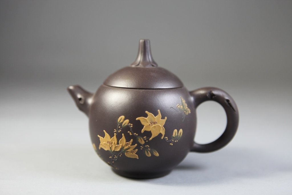 Traditional Chinese YiXing Clay Teapot: Authentic YiXing clay teapot in a rich brown with whimsical stem lid and gold overlay design 5" Length