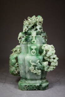 Green intricately carved jadeite vases w handles: Green intricately carved jadeite vases with handles 7" Length 10 1/4" Height