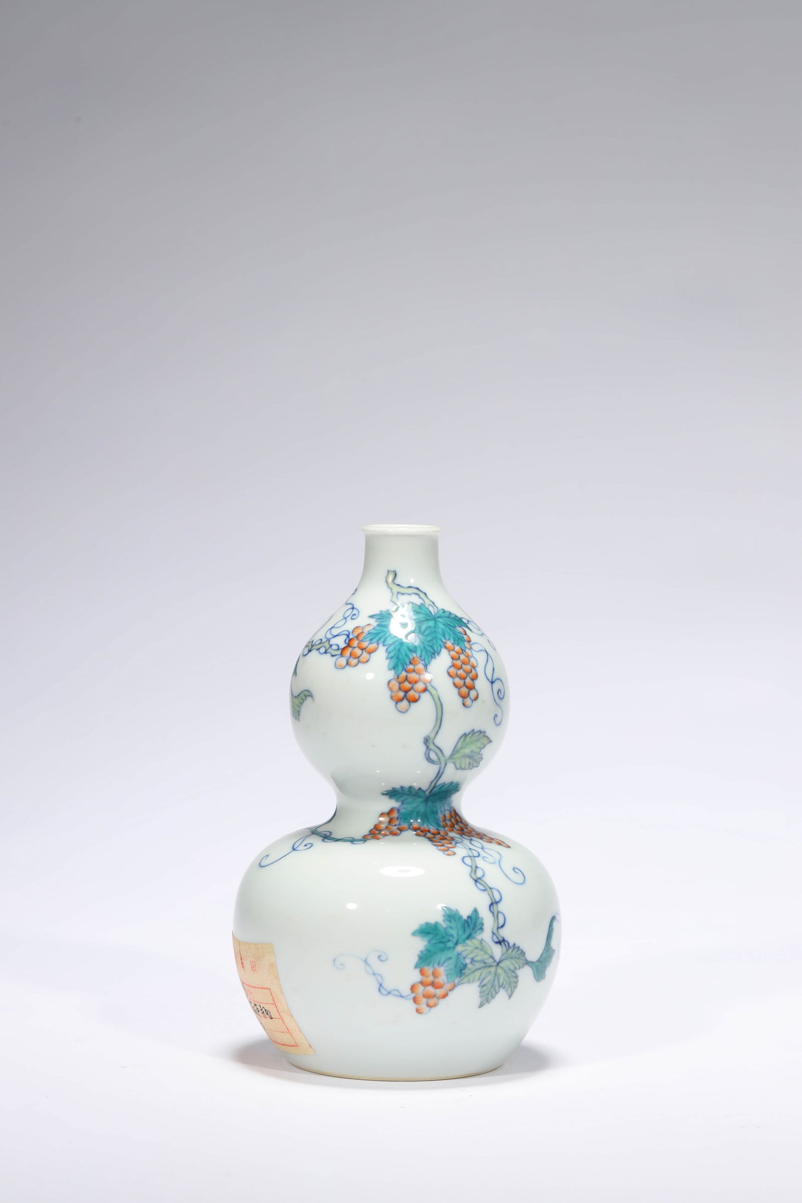 A DOUCAI ‘GRAPE AND SQUIRREL’ GOURD VASE (1 of 6)