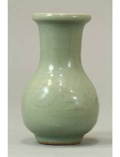 Chinese Antique Celadon Small Vase, Song Dynasty: Chinese Antique Celadon Small vase with slightly flared rim mouth and a suggestion of waves etched in white at the base. Song Dynasty 13th Century. Length 3.5" Height 5.75"