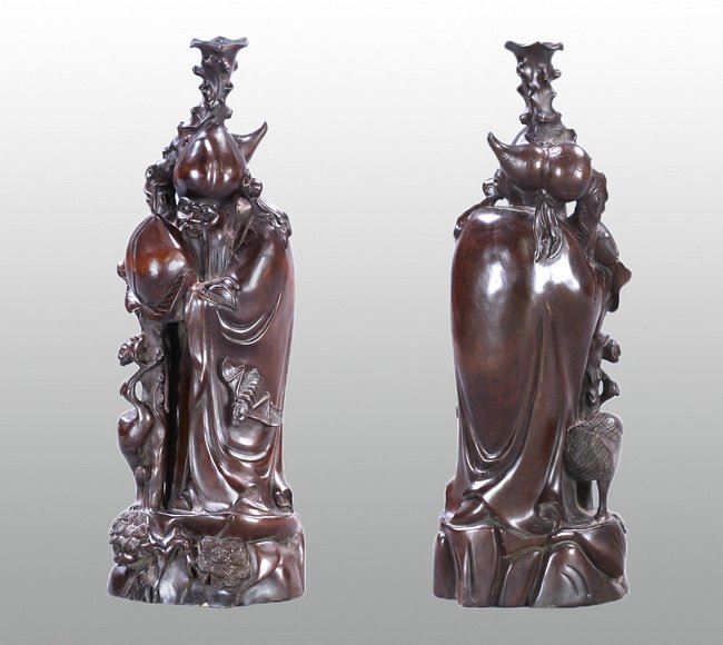 Chinese Carved Hardwood Longevity Figural: Carved figure representing longevity with a long flowing beard and a large scepter with a magical bat at the bottom of his flowing garments. Height 21"