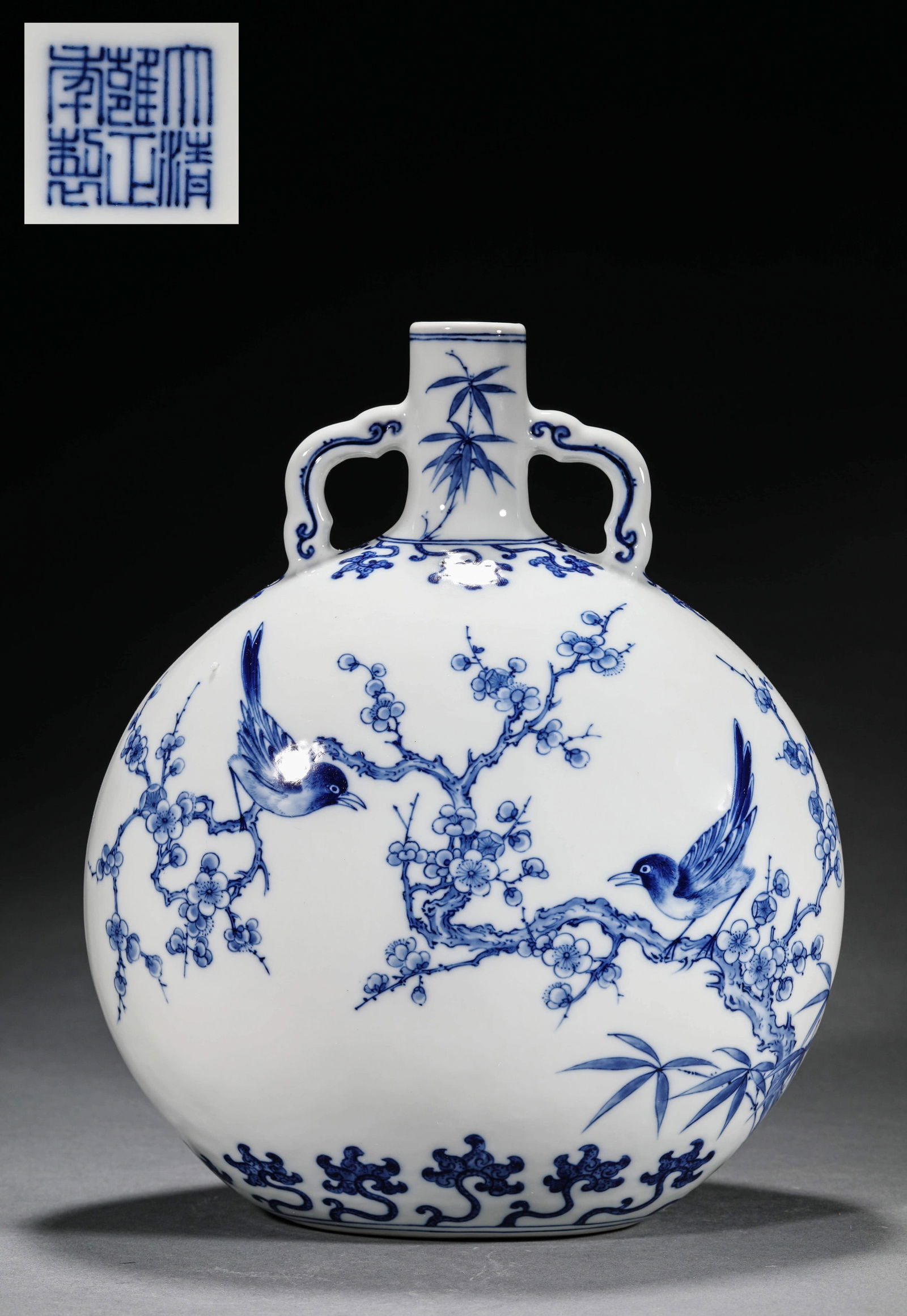 A BLUE AND WHITE 'MAGPIES ON PLUM' MOONFLASK: A BLUE AND WHITE 'MAGPIES ON PLUM' MOONFLASK Dimensions: Width: 23 cm (9.1 in.), Height: 30 cm (11.8 in.). All measurements are approximate.