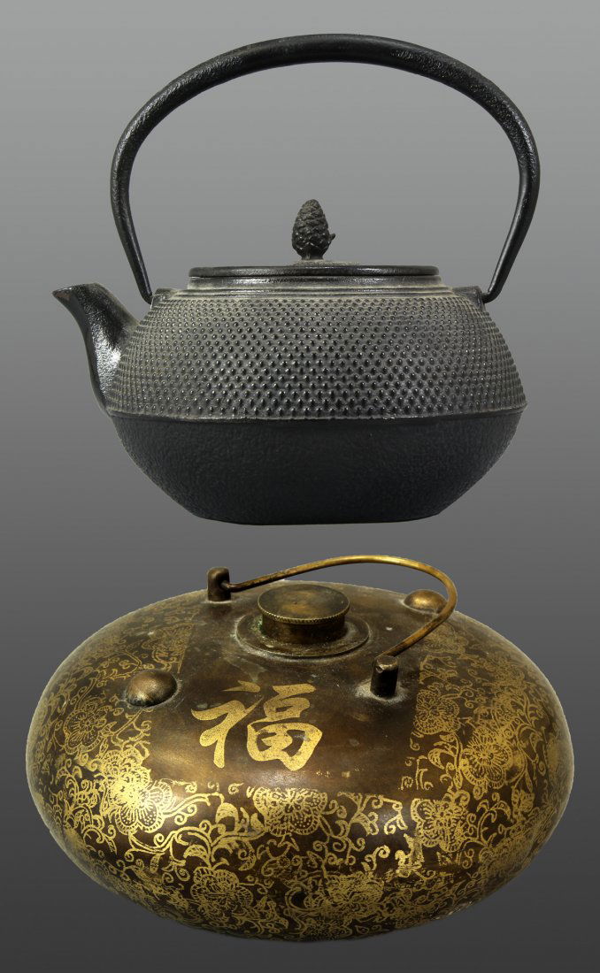 Japanese Cast Iron Teapot and Chinese Bronze Hand Warme: Chinese Bronze Hand Warmer with the chinese character 'Fu' Length 7" Height 6" Japanese cast iron tepot with ccorrugated siding, an oversized loop handle and artichoke detaillid. Length 7.2" Height 7.