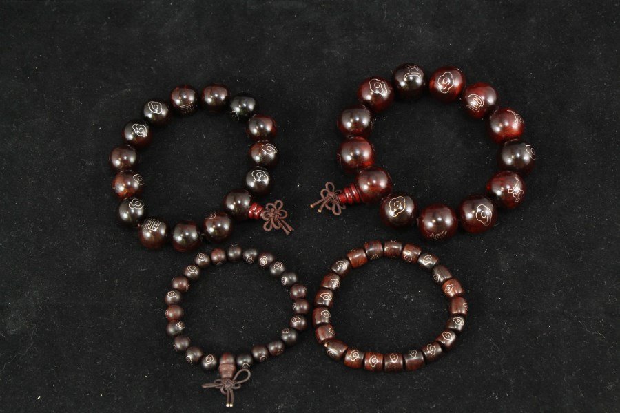 Four Chinese Zitan Rosewood Bracelets: Four Chinese Zitan Rosewood Bracelets. Diameter 0.75" (Largest Bead) 四串中国紫檀红木手链
